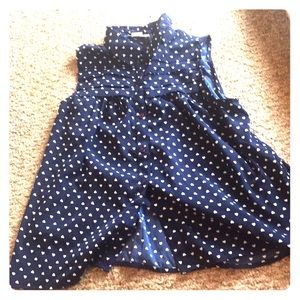 This is a cut-shoulder button-up top